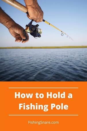 Hold a fishing pole properly
